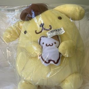 Pompompurin holding muffin plush